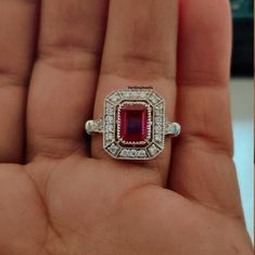 Beautifull Vintage & Art Deco Ring,2.00CT Emerald Cut Red Garnet Gemstone Ring,Halo Lab Diamond Ring,Best quality Silver ring. ▶ PRODUCT DETAILS ✦ Diamond Shape : Emerald cut ✦ Setting Type : Prong ✦ Metal Purity - 925 silver ✦ Color: Red garnet ▶ Accent Stones : * Color : White * Clarity: VVS * Shape : Round Moissanite Do mention it in the personalization section or concern with us by dropping a message. All Products of the shop will be customized with metal purity like 10K Solid Gold, 14K Solid Gold and 18K Solid Gold. Also It will be customized with Natural Diamond, Lab Grown (CVD - HPHT) Diamond, Natural Black Diamond, Natural Gemstone and Moissanites. If you have any additional questions about this ring, just hit the "Ask a Question" button (just to the right of the price) and we will Octagon Ruby Ring As A Gift, Red Emerald-cut Hallmarked Ring, Red Emerald Cut Rings With Accent Stones, Emerald Cut Ruby Ring With Halo Setting As Gift, Emerald Cut Red Gemstone Ring, Red Emerald Cut Ring, Red Gemstone Ring, Emerald Cut, Red Octagon Fine Jewelry Ring, Emerald Cut Hallmarked Ruby Ring For Gift