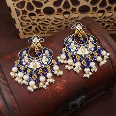 18k Gold Plated Indian Wedding Bollywood Enamel Kundan Pearl Studded Chandbali Earring For Women (E2920g) Dimension Earring Height 6.5 Cm X Width 4 Cm Quality - These Beautiful Earrings Are Handcrafted In Alloy With Pearls Of Good Quality. Coated With High Quality And Thickness Gold Polish. Go Ahead And Make Them All Yours Right Away Beauty - Stylish Designer Meenakari Worked Traditional 18k Gold Plated Drop Earrings With Lovely Combination Of Colors From I Jewels. These Designer Earrings, Made Blue Traditional Earrings For Reception, Traditional Blue Earrings For Reception, Elegant Blue Chandbalis For Wedding, Elegant Blue Chandbalis For Celebrations, Elegant Blue Bridal Earrings For Festive Season, Blue Temple Jewelry Bridal Earrings For Wedding, Blue Bridal Earrings For Wedding, Elegant Meenakari Danglers For Reception, Blue Kundan Bridal Earrings For Wedding