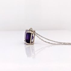 This gorgeous solitaire pendant features an emerald cut 10x8mm amethyst set in a solid 14k white, yellow, or rose gold setting. A perfect birthday gift for February babies, this magnificent purple gemstone will make any outfit sparkle and shine. Let your beauty shine! Choose between a 16" or 18" chain so we can make sure your pendant is perfectly centered! Emerald Cut Amethyst Birthstone Jewelry, White Gold Birthstone Jewelry With Radiant Cut, White Gold Jewelry With Birthstone In Radiant Cut, White Gold Radiant Cut Birthstone Jewelry, Fine Jewelry White Gold Amethyst With Emerald Cut, Radiant Cut Birthstone Jewelry As Gift, Radiant Cut Birthstone Fine Jewelry, Purple Rectangular Jewelry With Prong Setting, Fine Jewelry With Rectangular Purple Stone