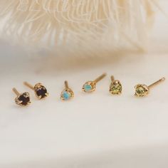 14k Gold Birthstone Studs shown on white backdrop. Three pairs: red garnet, blue opal and green peridot Second Piercings, Second Piercing, Birthstone Earrings, Birthstone Earring, Fine Earrings, Try On, Gemstone Earrings, Jewelry Care, A Month