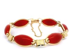 -Stone(s)- (6) Synthetic Coral - Marquise Cabochon - Bezel Set - Ox Blood red Color - 17.73 x 9.77mm (approx.) Material: 13k-14k Yellow Gold Weight: 16.64 Grams Length: Will comfortably fit 7" wrist (measured on wrist) Closure: Plush clasp w/ safety chain Width: 11.38mm (0.44") (approx.) Thickness: 5.10mm (approx. - rise off wrist) Condition: Shows some wear, original finish & patina preserved. Excellent overall condition. Stock Number: JO-16045099 Formal Cabochon Bracelet Jewelry, Oval Cabochon Bracelets For Formal Occasions, Red Antique Bracelet For Formal Occasions, Antique Red Bracelet For Formal Occasions, Vintage Red Gemstone Bracelets, Vintage Red Jewelry With Polished Finish, Elegant Red Jewelry With Cabochon, Elegant Red Cabochon Jewelry, Red Oval Cabochon Jewelry With Polished Finish