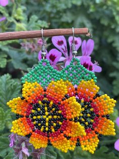 Beaded dangle earrings  Measurements do not include the earring wire hook:  6cm long 5cm wide Multicolor Beaded Flower Drop Earrings, Multicolor Beaded Drop Flower Earrings, Multicolor Teardrop Flower Earrings With Ear Wire, Handmade Multicolor Teardrop Flower Earrings, Flower Earrings With Ear Wire For Festivals, Multicolor Handmade Teardrop Flower Earrings, Colorful Beads Flower Shape Earrings, Adjustable Flower-shaped Earrings With Colorful Beads, Unique Colorful Beaded Dangle Flower Earrings