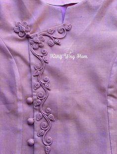 the back of a purple dress with flowers on it