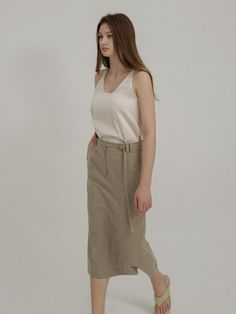 This is a trendy and minimal skirt by AVA MOLLI that is made out of high quality and sturdy material. With distinctive mood of the design and feminine look, you can style it for your trendy and casual daily outfit.- H line silhouette- Belt included with double belt loop- Set up with matching jacket Beige Asymmetrical Relaxed Skirt, Casual Neutral Midi Skirt, Chic Long Skirt In Neutral Color, Chic Flowy Neutral Skirt, Chic Beige Long Skirt, Chic Neutral Long Skirt, Beige Asymmetrical Lined Skirt, Beige Asymmetrical Skirt With Lining, Elegant Neutral Skirt