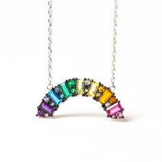 Bring a little hope and color into your wardrobe with this stunning Rainbow CZ "Hope" Baguette Crystal Necklace. This gorgeous necklace features an elegant, rainbow-shaped design crafted from a rainbow of cubic zirconia crystals. The subtle sparkle and pop of color is sure to brighten up any look. The necklace is adjus Cheap Rainbow Dangle Jewelry, Rainbow Jewelry Aesthetic, Colorful Jewelry Aesthetic, Crystal Aesthetic, Nail Jewels, Origami Owl Jewelry, Crystal Jewelry Sets, Rainbow Jewelry, Rainbow Necklace