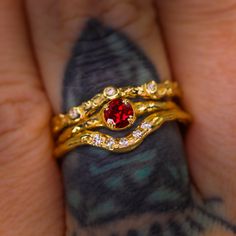 Introducing our elegant Magnolia ring solitaire. We offer this as made to order with a selection of 22 gemstones which can be found here (shown is an example of 14K yellow gold with lab-grown ruby; the pictured ring is sold). Four double-prongs clasp a smaller 4mm round brilliant cut lab-grown ruby. This ring can be customized with diamonds set into the band (not pictured, please see our 22-gemstone made to order Magnolia ring listing for examples of side diamonds). -- Custom?: We can create you Promise Ruby Ring In 14k Gold, Ethically Sourced, Garnet Diamond Promise Ring In Yellow Gold, Yellow Gold Garnet Diamond Promise Ring, Red 14k Gold Birthstone Ring For Promise, Yellow Gold Garnet Rings With Prong Setting, Ruby Birthstone Ring In Round Cut, Yellow Gold Ruby Ring With Bezel Setting For Promise, Lab-created Ruby Birthstone Diamond Ring, Yellow Gold Birthstone Ring With Round-cut Lab-created Ruby