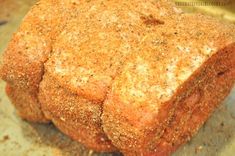 a piece of bread that is sitting on top of a pan with some seasoning