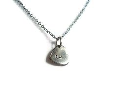 "Personalized Heart Pendant Necklace, Gift for Her, Bridesmaid Jewelry This personalized necklace features a hand stamped letter on a heart pendant.  Stainless steel heart charm measures 11x10x0.6mm and is set on a 17\" 2mm silver tone brass chain complete with a lobster clasp.  Great to wear alone or layer with your other favorites from The Phlox Shop! Please let me know what letter upon purchase! For special sizing, please just let me know! All measurements are approximate." Hand Stamped Heart Sterling Silver Charm Necklace, Sterling Silver Hand Stamped Heart Charm Necklace, Simple Silver Heart Charm Necklaces, Simple Silver Heart Charm Necklace, Silver Stamped Charm Necklace For Valentine's Day, Silver Stamped Charm Necklaces For Valentine's Day, Hand Stamped Sterling Silver Heart Pendant Necklace, Sterling Silver Hand Stamped Heart Pendant Necklace, Valentine's Day Silver Stamped Charm Necklaces