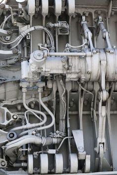 the inside of an airplane engine with multiple hoses