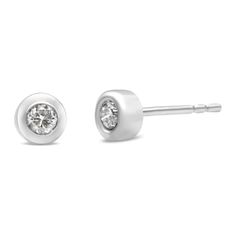 Shine like a diamond by wearing these elegant stud earrings. Fashioned in a contemporary bezel frame, these earrings are stunningly crafted from 10 Karat gold, with near-colorless natural diamonds nestled in the center. Butterfly push-backs on friction notched posts ensure carefree all-day wear. The overall appearance of these sweet earrings will win compliments every time you wear them. Modern White Gold Earrings With Bezel Setting, Modern Diamond Earrings With Bezel Setting, Shine Like A Diamond, Sweet Earrings, Fine Ring, Colorless Diamond, Bridal Bands, Bracelet Collection, Bezel Diamond