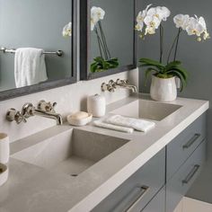 A gray floating dual sink vanity topped with a light gray quartz countertop is accented with polished nickel pulls and polished nickel faucets mounted to a light gray quartz backsplash under galvanized metal framed medicine cabinets fixed to gray walls. Floating Marble Sink, Floating Sink Vanity, Grey Grasscloth Wallpaper, Grey Quartz Countertop, Frameless Vanity Mirrors, Polished Nickel Faucet, Quartz Sink, Quartz Backsplash, Two Is Better Than One