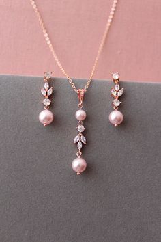 Rose Gold Round Jewelry Sets For Weddings, Rose Gold Teardrop Wedding Jewelry Sets, Rose Gold Teardrop Jewelry Sets For Wedding, Party Rose Gold Dangle Jewelry Sets, Rose Gold Pearl Drop Jewelry For Party, Party Rose Gold Jewelry With Pearl Drop, Elegant Pink Jewelry Sets For Wedding, Pink Wedding Necklaces With Matching Earrings, Party Rose Gold Pearl Drop Jewelry