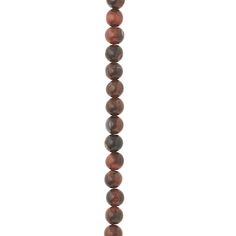 a long beaded necklace with gold and brown beads hanging from it's side