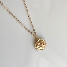 The Rose - A timeless symbol of love and beauty! This handcrafted Rose Pendant Necklace is a lovely piece for special occasion or everyday!  Whether worn alone or layered, it's the perfect gift for ladies of all ages - Moms, friends, sisters, or the bridal party. :: DETAILS :: ♥ Rose pendant is handcrafted of 14K Gold fill, 14K Rose Gold fill, or Sterling Silver; it measures approximately 1/2" in diameter. The length of the pendant is 3/4" including bail.  Each pendant will vary slightly due to Rose Detail Jewelry For Wedding, Rose Gold Jewelry With Rose Detail For Gift, Rose Flower Necklace With Rose Design, Delicate Rose Necklaces For Gifts, Delicate Rose Necklace With Roses Detail, Delicate Rose Necklace For Gift, Rose Flower Necklaces For Wedding, Rose-colored Rose Design Round Necklaces, Rose Flower Necklace For Wedding