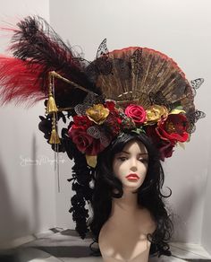 This Fan and flower headpiece  is unquestionably unique and one of a kind handmade by me.   It is inspired by my love of red and gold colors.  It is made from high quality silk flowers in red golds and black.   The fan is approximately 13 inches in height and sits slightly to the side to allow for the beautiful cascading flowers.  It has beautiful high quality crystals, dangle rhinestones in a clear silver tone pallet and hand dyed gold tasiles.  There's even a dragon head handpainted in gold and butterflies in black  All this beauty sits on my signature headband design for comfort.  The entire piece sits on top of your head.    Definetly get you noticed perfect for a wedding or cosplay or a dancer. Would make a beautiful theater headpiece or photographer prop or a Fairy.  This style to ma Red Fantasy Headpiece For Costume Party, Fantasy Red Headpiece For Costume Party, Red Fantasy Costume Headpieces, Red Tall Crown Costume Hat For Party, Fantasy Festival Costume Hats And Headpieces In Red, Red Crown Headpiece For Wedding, Red Festival Crown Headpiece, Red Crown Headpiece For Parties, Red Crown Headpieces For Party