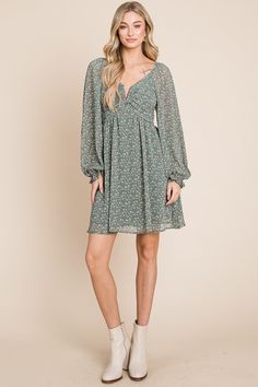 The perfect breezy dress to wear year-round, featuring a flattering draped fit, long sheer sleeves, split-neck detail, and open back. Material: 100% Polyester, 100% Rayon lining Flowy Long Sleeve V-neck Dress For Party, Fitted Long Sleeve Chiffon V-neck Dress, Flowy V-neck Dress With Surplice Neckline For Date Night, Chic Chiffon V-neck Midi Dress, Chic Flowy V-neck Dress With Floral Print, Casual Long Sleeve Chiffon Dress, Chic Flowy Mini V-neck Dress, Spring Dress With Gathered Sleeves And Surplice Neckline, Chic Flowy Mini Length V-neck Dress