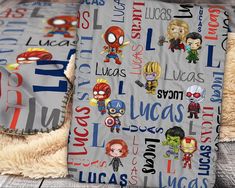 the blanket has many different avengers characters on it