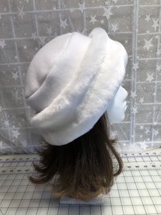 "I made this beautiful Snow White hat out of soft white beaver faux fur and white fleece. The brim is a 3 1/2 inch frame of white beaver faux fur and the hat is lined with a double layer of white fleece for warmth and comfort. Sized to fit most adults 22\"-23\" around head. The hat is a comfortable fit on my 22 1/2\" head. Spot clean or dry clean. Handmade in Albany, Oregon by me!" White Fur Felt Hat For Winter, White Fur Felt Winter Hat, White Brimmed Felt Hat For Winter, Adjustable White Felt Hat For Winter, White Short Brim Felt Hat For Winter, Adjustable White Fur Felt Hat, White Adjustable Fur Felt Hat, White Curved Brim Fur Felt Hat, White Faux Fur Winter Hat