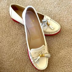 Nwot Size 9 White Soft Pebble Leather And Pink Rubber Sole Loafers/ Flats. Has Been Sitting In My Closet And Has Never Been Worn. There Is A Small Puncture (The Size Of A Dot) On The Exterior Of The Left Shoe That May Have Been Due To Being Open Box But Otherwise So Signs Of Damage. Item Will Not Come With A Box. Please Feel Free To Ask Any Questions! White Tassel Loafers With Leather Sole And Round Toe, White Tassel Loafers With Round Toe For Spring, White Tassel Loafers For Spring Workwear, White Summer Flats For Office, White Flats For Summer Office Wear, White Flats For Office In Summer, Summer Office White Flats, Elegant White Tassel Loafers For Spring, White Slip-on Moccasins With Round Toe