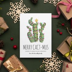 a christmas card with a cactus drawn on it and presents around the holiday tree branches