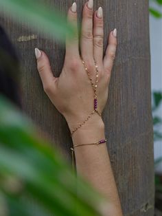 Genuine Ruby Hand chain bracelets. Simple and elegant, easy to combine with many styles and most importantly energetically charged to bring more love, passion, connection, wealth into your life. These are just some of many properties of Ruby Gemstone.  Ruby beads are round faceted in size 3-4mm. Chain base is stainless steel that is 18k gold Ion Plated, making it resistant to tarnishing for a long time.  PROPERTIES OF RUBY Ruby is believed to promote loving, nurturing, health, knowledge and weal Gold Hand Chain, Bracelets Simple, Chakra Heilung, Romantic Anniversary Gifts, Heart Chakra Healing, Hand Chain Bracelet, Romantic Anniversary, Bracelet Love, Anniversary Gift For Wife