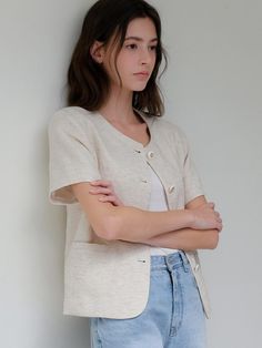 This is a minimal and feminine jacket by ourcomos that is made out of high quality and sturdy material. With distinctive mood of the design and comfortable wear, you can use it for your daily lifestyle.- Soft touch of linen and light cotton lining- Gold buttons on oatmeal fabric- Side pockets detail- Modern and minimal mood Beige Linen Casual Cardigan, Casual Beige Linen Cardigan, Beige Relaxed Fit Linen Cardigan, Beige Linen Cardigan With Relaxed Fit, Neutral Linen Outerwear For Everyday, Everyday Neutral Linen Outerwear, Casual Cream Linen Outerwear, Feminine Jacket, Summer Linen