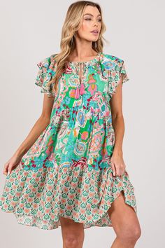 Effortlessly elegant and vibrant, the Delilah Ruffle Sleeve Dress is a must-have for any fashion-forward wardrobe. With its colorful paisley print and tiered A-line silhouette, this midi dress exudes feminine charm. Crafted from lightweight and breathable 100% rayon, it features playful ruffle sleeves and an easy over-the-head pull-on design. Perfect for any occasion, this dress offers both style and comfort in one. No Stretch, but has a very flowy fit! MATERIAL: 100% RAYON Due to monitor differences, actual colors and/or patterns may vary slightly from online. Hand or machine wash cold Do not bleach Hang to dry PLEASE CHECK MEASUREMENTS: BUST"/LENGTH" SMALL - 40"/37" MEDIUM - 42"/38" LARGE - 44"/38" Curvy Shorts, Ruffle Sleeve Dress, Ruffle Sleeves, Outdoor Wear, Paisley Print, Sleeve Dress, Fashion Forward, Paisley, Short Dresses