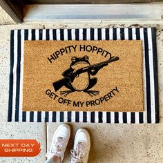 a door mat with the words happy hoppy get off my property next to shoes