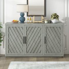 a sideboard with two drawers and a lamp next to it