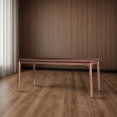 a wooden table sitting in front of a window on top of a hard wood floor