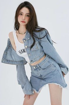 This Cropped Denim Jacket and Distressed Hem Mini Skirt Two-Piece Set is the perfect mix of style and comfort. Each piece can be worn alone or together, and the asymmetric hem on the denim skirt adds a unique touch. Finish the look with a pair of leg warmers and your favorite pair of boots or sneakers.
Gender: WomenMaterials: Denim, PolyesterTop Length: ShortCollar: Polo CollarSkirt Length: Above Knee, MiniSleeve Length: Long SleevesSleeve Style: Regular  Sleeve Chic Summer Denim Jacket With Frayed Hem, Trendy Summer Denim Jacket With Frayed Hem, Summer Denim Jacket With Frayed Hem For Day Out, Fitted Denim Jacket With Frayed Hem For Summer, Trendy Ripped Denim Vest For Spring, Trendy Ripped Denim Top For Spring, Spring Denim Blue Cutoff Top, Spring Cutoff Denim Blue Top, Spring Ripped Denim Jacket