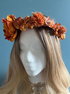 A floral headpiece / flower crown perfect for Fall. Adjustable! Features orange artificial flowers and some white plastic pumpkins and other decorative elements, as well as an orange ribbon.  Fabric covered wire makes the base of this crown. Flowers are attached by a secure combination of twisted wire, sewing, and glue. Perfect for Ren Faires, Festivals, and Fairy Play! Festival Crown, Headpiece Flower, Thanksgiving Flowers, Fleur Orange, Plastic Pumpkins, Pumpkin Flower, Orange Ribbon, Flower Headpiece, Floral Headpiece