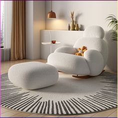 a white chair and ottoman in a room with a rug on the floor next to it