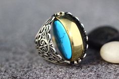 Sterling Silver 925 Turquoise Handmade Ring, Ottoman Style Ring, Silver 925 Ring, Gift for HimSilver Ring, Ottoman Style RingRing weight is  16 gramsHead size is 25 mmit is unique handmade item grey material is silveryellow material is bronzeWe send orders with Free Shipping ,if you prefer you can contact with us Express ShippingAll Sizes Availabes Just Tell me the size you needEach ring is handcrafted and is stamped on the insideThank you Bohemian Turquoise Ring As Gift With Polished Finish, Ring Man, Leopard Fashion, 925 Ring, Grey Material, Quartz Bracelet, Ring Sterling Silver, 925 Silver Rings, Ring Silver