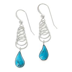 Jay King Sterling Silver Kingman Turquoise Earrings Dangling from a sterling silver, spring-shaped spiral design, drops of beautiful Blue Basin Kingman turquoise give these handcrafted earrings a fun, playful vibe. From Jay King.       Approx. 1-11/16"L x 3/8"W      Stamped .925     Pierced with wire backs     Sterling silver earrings have spring-shaped spiral drops with stylized teardrops of blue Kingman turquoise dangling from base     All stones bezel-set   Stone Information       All sizes a Hypoallergenic Turquoise Sterling Silver Teardrop Earrings, Hypoallergenic Turquoise Teardrop Earrings In Sterling Silver, Turquoise Sterling Silver Teardrop Dangle Earrings, Unique Spiral Turquoise Jewelry, Turquoise Sterling Silver Long Drop Earrings, Turquoise Long Drop Sterling Silver Earrings, Hypoallergenic Spiral Sterling Silver Jewelry, Turquoise Drop Sterling Silver Jewelry, Blue Spiral Sterling Silver Jewelry