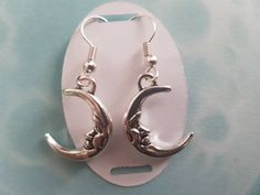 Gorgeous Celestial half moon, drop earrings. Suitable for winter solstice and all year around. There is a matching necklace Please check the listing below. https://www.etsy.com/uk/listing/648388547/celestial-moon-necklace-halloween-world?ref=listing-shop-header-2 These can be customised just message me for details. Materials Tibetan Silver Silver Plated Hooks Postage All items will be sent first class. The estimated delivery will be between 1- 3 days (UK) and out side the UK it will be 7 -14 day Handmade Adjustable Half Moon Earrings, Handmade Half Moon Earrings, Dangle Earrings With Sun And Moon Design For Gift, Silver Earrings With Sun And Moon Design As Gift, Silver Sun And Moon Design Earrings For Gift, Sun And Moon Design Dangle Earrings Gift, Sun And Moon Design Dangle Earrings For Gift, Adjustable Hypoallergenic Crescent Jewelry, Adjustable Half Moon Earrings As Gift