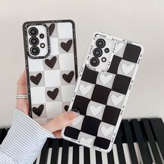 two cases that have hearts on them, one is white and the other is black