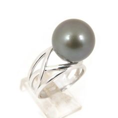 Elegant designed ring, made of 925 sterling silver (stamped) with an organic natural color, Tahitian south sea cultured pearl from French Polynesia. The enormous size, genuine seawater pearl exhibits a high luster, thick nacre & smooth surface with minor natural spots/birthmarks; kindly refer to the photos of the actual ring for detail.  The ring is currently US size #8.  I don't do re-sizing but it should be easily done by your local jeweler.  Style: Ring Precious Metal: 925 Sterling Silver Rin Tahitian Pearl Ring, French Polynesia, Pearl Types, Tahitian Pearls, Precious Metal, Pearl Size, Pearl Ring, Cultured Pearls, Rings Statement