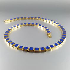 Blue Lapis lazuli square collier necklace with solid 18k gold inlay work. Unique gift for her, wife, girlfriend, woman, September and December birthstone, 9 year anniversary.  Sophisticated elegance and the royal color of blue Lapis Lazuli make this a masterpiece. The stone is worked seamlessly into the solid 18K gold pieces. Each piece is worked not to be a perfect square and to give a curve to the collier and grantee a perfect fit. All our inlay work is real stone, not ceramic dust. Dimensions & features: ▪️ Genuine Lapis Lazuli AAA Grade ▪️ Stone shape and size: square 5 x 5-4 x 2 mm ▪️ weight: 51.61 g ▪️ Carats: 11 ▪️ Gold: 49.41 g ▪️ Metal: 18k (750) Gold ▪️ 18k (750) hallmark ▪️ Source: fair trade ▪️ Handmade in Germany Please note: minor differences in shape and color are possible. 9 Year Anniversary, Royal Colors, Gold Piece, Blue Lapis, Real Stone, Wedding Jewellery Necklace, Unique Gifts For Her, December Birthstone, Blue Gemstones