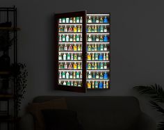 an open window with bottles on it in front of a couch