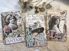 three cards with pictures of women and flowers on them, one has a bird perched on it