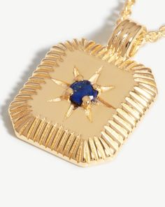 Star Ridge Birthstone Pendant Necklace | 18k Gold Vermeil/Lapis Lapis/September. Bring Your Birth Month a Whole New Meaning with a Personalized Gemstone Necklace. The Ridged Pendant, Held on a Short Chain Necklace, Holds a Natural Lapis Stone, Symbolizing Strength and Courage, and is Embellished with a Central Star Motif. The Perfect Gift for Anyone Born in September. Please Note: Engraving Items May Take 2 Working Days to Process. Metal: 18K Recycled Gold Plated Vermeil on Recycled Sterling Sil Celestial Gold Gemstone Jewelry, Yellow Gold Pendant Jewelry With Jewels, Luxury Gold Plated Jewelry With Rectangular Pendant, Luxury Gold Plated Rectangular Pendant Jewelry, Gold Plated Gemstone Amulet Jewelry, Gold Gemstone Pendant Jewelry, Gold Pendant Jewelry With Gemstone, Gold Plated Gemstone Necklace With Rectangular Pendant, Yellow Gold Plated Square Pendant Jewelry