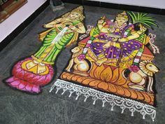 two colorfully painted figures on the ground