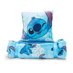 a blue blanket and pillow with an image of stitchy stitching on the back