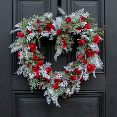 a christmas wreath is hanging on the front door