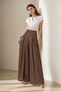 You can Pair them with a fitted top for a balanced look. Elevate your wardrobe - experience the blend of luxury and comfort with our linen wide-leg pants. DETAILS: * 100% linen, the wide-leg pants is made from high-quality linen, providing a breezy and comfortable feel. * Two side pockets * Zipper and button front closure * Pleated detail * High waisted pants * Wide leg pants * Perfect for spring, summer * Dry clean MODEL SIZE Bust 85 cm(33.4") Waist 67 cm(26.7") Height 168cm (5' 6") She wears s Cotton Wide Pants, High Waisted Button Pants, Wide Leg Pants Outfit With Heels, Pant Trousers Women Outfit Wide Leg, Split Side Pants, Linen Pants Women Summer, Wide Pant Leg Outfit, Pleated Trousers Women High Waist, High Waist Linen Pants