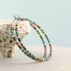 "Lightweight, boho hoop earrings with colorful beads. * DETAILS: ‣ tiny (2 mm), Japanese glass seed beads in an array of colors - orange, yellow, blue, turquoise, mint, green, rose, beige, bronze, red bronze and hematite ‣ carefully handmade and polished earring hoops (316L grade stainless steel) * SIZE: ‣ approx Ø: 1.6\" / 4.2 cm Very lightweight, comfortable earrings. A matching necklace is available here: www.etsy.com/listing/1567760485 Click here for more beaded hoop earrings: www.etsy.com/s Beaded Earring Designs, Fun Earrings Unique, Hoop Earrings With Beads, Comfortable Earrings, Earrings With Beads, Mint Earrings, Boho Hoop Earrings, Earring Hoops, Statement Hoop Earrings