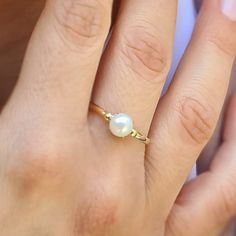 Engagement Gold ring, 14k Gold ring, Gold ring with pearl, ivory pearl gold ring, bridal pearl ring, bridesmaid gift This Shell handmade Gold ring with Pearl is made of 14K genuine gold and set with Natural Pearl. This Stunning Ring is set with Best AAA+ Quality Natural Pearl set in 14k Yellow Gold. High end finish with easy touch of diamond cut. This 14k Gold ring can serve as an engagement ring or a birthday gift. All colors at the picture are available. * Gemstone -6mm Round Natural Pearl. * Gold Ring With Pearl, Pearl Gold Ring, Ring With Pearl, Handmade Gold Ring, Etsy Bridesmaid Gifts, Ivory Pearl, Pearl Set, Natural Pearl, Cute Rings