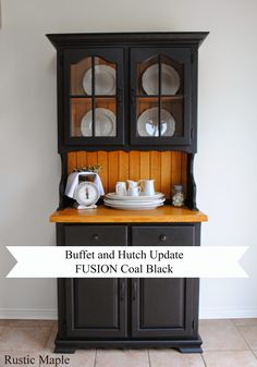 a black hutch with white plates on top and the words buffet and hutch update