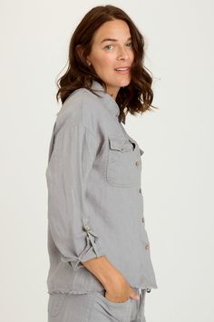 A distressed hem, breast pockets, cuffable sleeves, and a slightly shorter silhouette add intrigue to this classic blouse. In breathable Light Linen, Rorin just became your latest versatile, go-to piece! Light Linen: 100% Linen. Center Front: ~20.75". Center Back: ~25". Color Description: Simple light grey. Preshrunk. Machine washable. Imported. MODEL Whitney is wearing size Small. Height: 5'10" | Bust: 34A | Waist: 26" | Hip: 37" Casual Blouse With Roll-up Sleeves And Shirttail Hem, Casual Blouse With Pockets And 3/4 Sleeves, Rolled Sleeves Long Sleeve Tops For Casual Gatherings, Buttoned Pockets Blouse With Shirttail Hem, Spring Linen Tops With Flap Pockets, Relaxed Fit Blouse With Pockets And 3/4 Sleeves, Relaxed Fit Tops With Buttoned Pockets, Casual Linen Blouse With Pockets, Relaxed Fit Tops With Pockets And 3/4 Sleeves